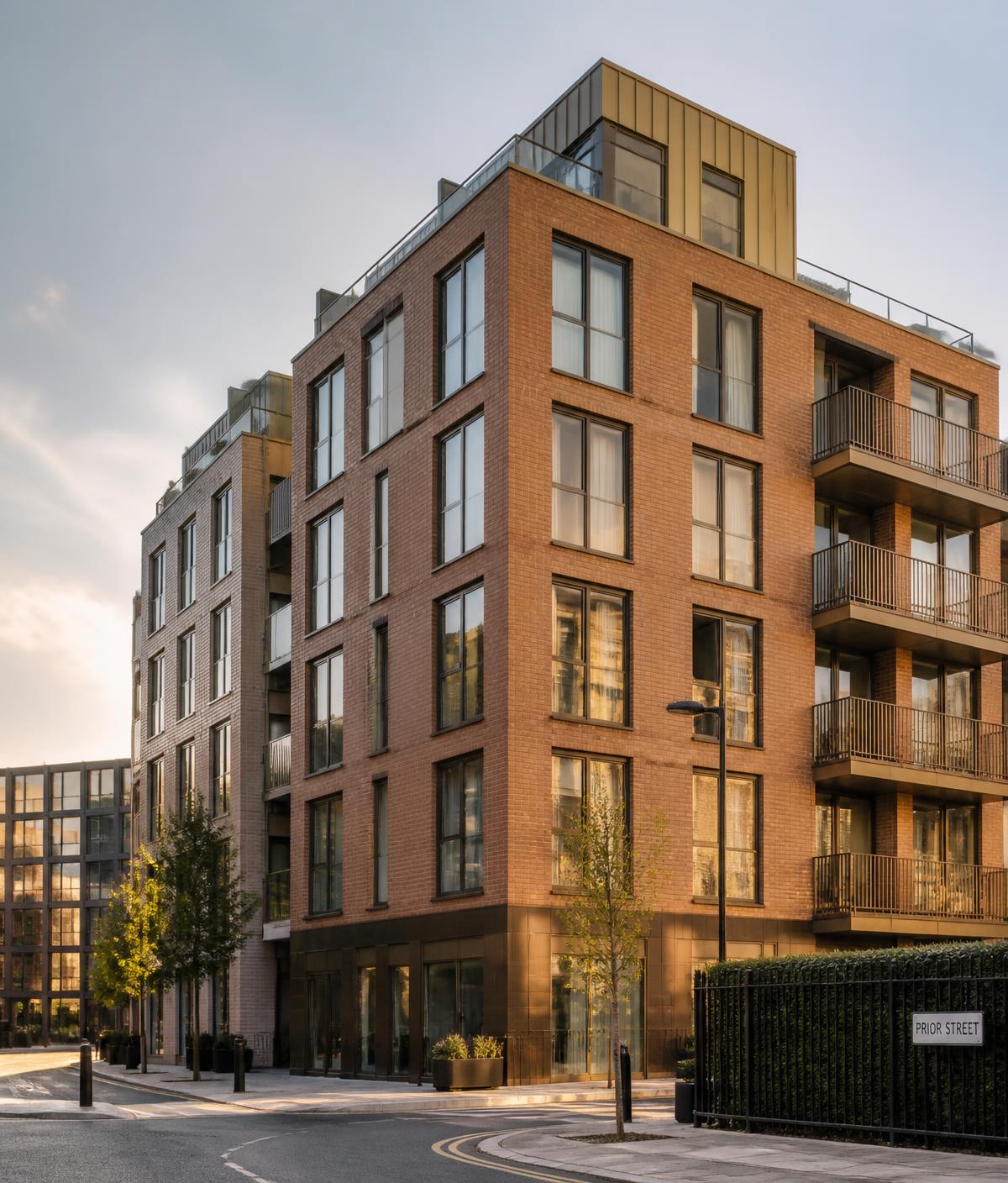 Modern UK residential apartment building at golden hour